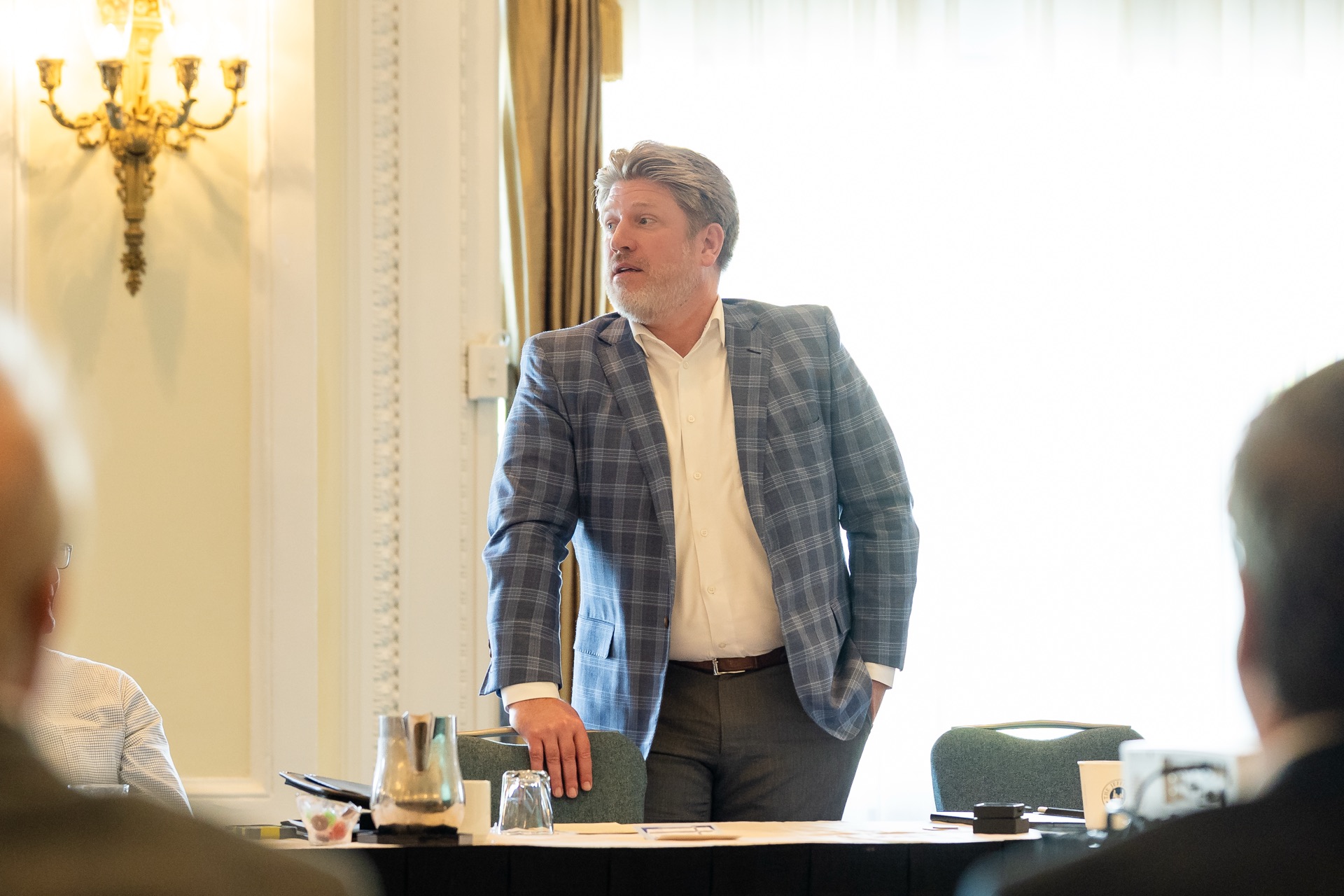 An Elevate advisor leading a discussion